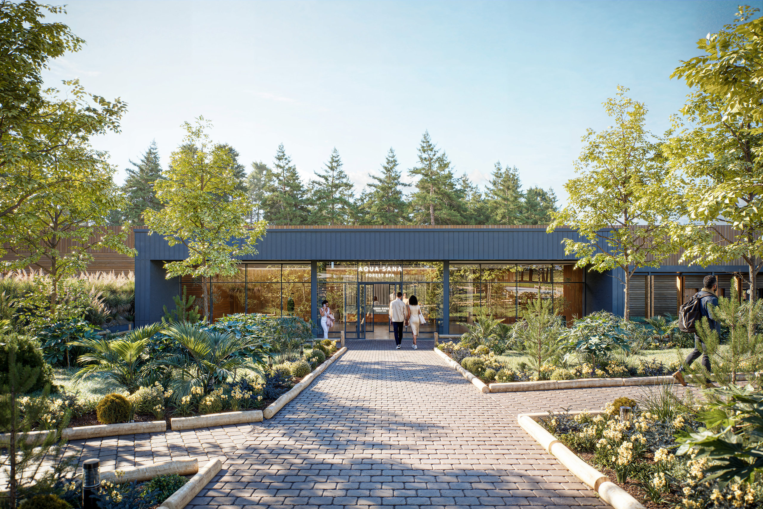 Entrance to spa, with people walking on path, trees and flowers.